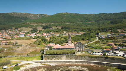 drone view of Santa Maria de oya monastery on a sunny day