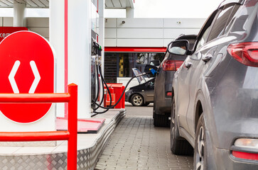 People in cars waiting to fill up vehicles with gas. Waiting to pump petrol during fuel crisis