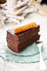 dessert chocolate cake on a transparent plate on the table vertical photo
