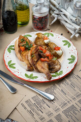 fried chicken legs in a white plate on the table
