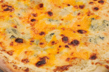 pizza with four cheeses macro photo
