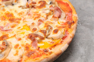 pizza with mushrooms, meat and cheese macro photo
