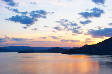 Fototapeta na wymiar Beautiful landscape with sunset on the sea shore.