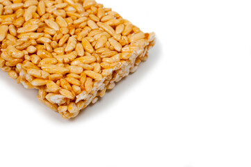 Sweetness from grains of puffed rice, shot close-up on a white background.