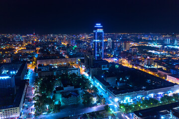 Fototapeta na wymiar Aerial view of the night modern city. Bright lights of the night streets. Ekaterinburg. Russia