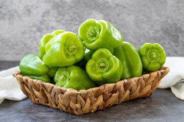 Bell Pepper on dark Background. Fresh bell pepper in a basket. Organic vegetable. close up