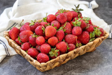 Ripe strawberries on a dark background. Fresh strawberries in a basket. Organic food. close up