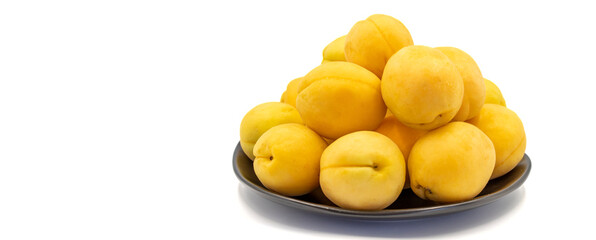 Ripe apricot isolated on white background. Fresh and juicy apricots on the plate. Organic food. Copy space. Space for text