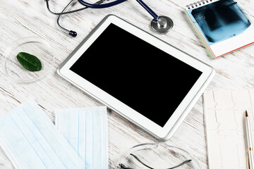 Mock up of doctors desktop with medical supplies