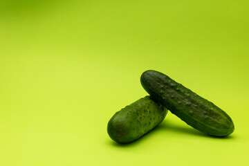 Cucumbers on a green background, monochrome