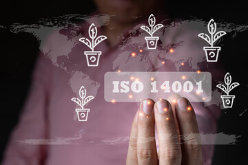 A businessman holding the ISO 14001 environment label, plant icon, graphic light standard quality document control for organization and industry management products, copy space for text