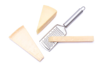 Piece of parmesan cheese and grater isolated on white background