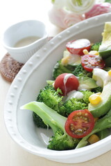 Avocado, cherry tomato, broccoli and sweet corn salad