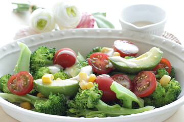 Avocado, cherry tomato, broccoli and sweet corn salad