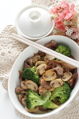 Chinese food, sliced mushroom and broccoli stir fried with pork