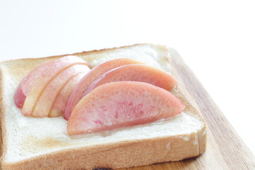 Japanese peach on toast with copy space for summer gourmet cooking