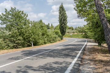 road bending in hilly landscape, near Ponzano in Chianti, Italy
