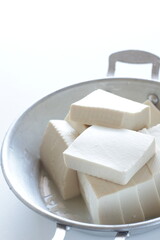 chopped tofu in stainless steel pan for cooking ingredient