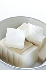 chopped tofu in stainless steel pan for cooking ingredient