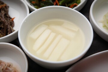 It is kimchi, a traditional Korean food. This is called dongchimi.