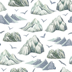 Watercolor winter mountains seamless pattern. Hand painted high frozen mountain peaks with flying birds isolated on white background. Nordic scandinavian design in blue and gray color for wrapping