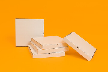 pizza boxes on yellow background