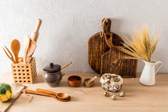 a set of various kitchen utensils of a country house, a cottage on a wooden countertop. interior items. ecologically clean kitchen.