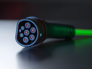 Black electric vehicle charger on table