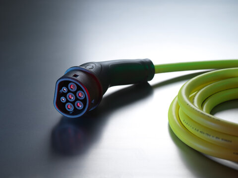 Electric vehicle charging cable on table