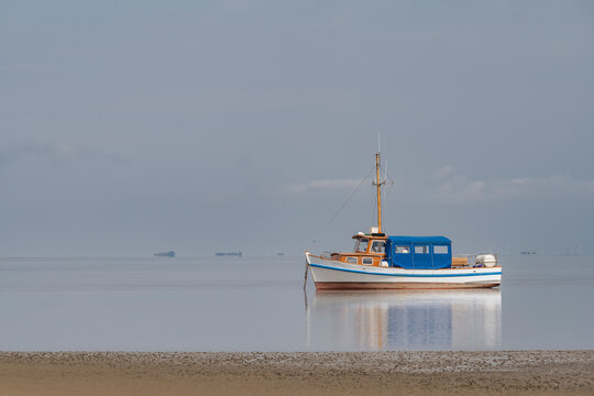 Germany, Schleswig-Holstein, Pellworm, Fishing boat at low tide