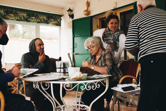 Artists painting together at home