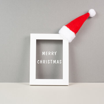 Frame with red Santa Claus hat, winter  greeting card, merry christmas
