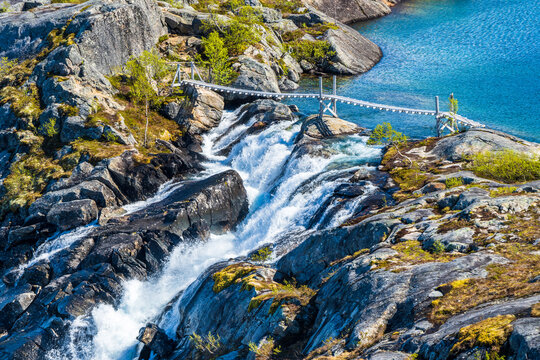 Norway, Nordland, Bridge over Litlverivassfossen waterfall in Rago National Park