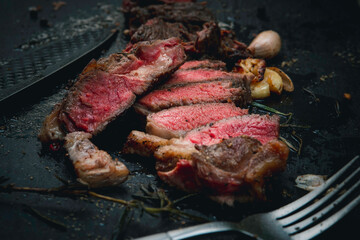 medium rare steak on a slate plate