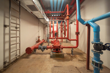 Industry factory. Chiller tower on rooftop building. Fire protection system work machine. Condenser Water Supply pipe lines. Workshop site.