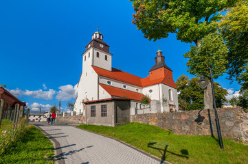 Fototapeta premium Wiele - village in Pomeranian Voivodeship, Poland. St. Nicholas Church.