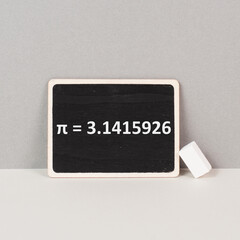 The mathematical constant pi 3,141 is standing on a chalkboard, defined in Euclidean geometry as...