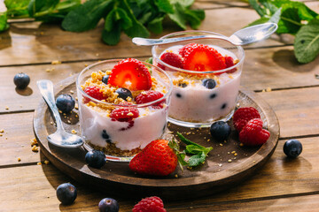 Strawberries and berries served with fresh yogurt