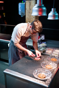 Chef serving meal in dishes