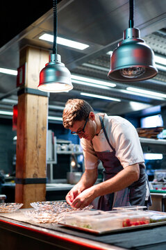 Chef serving meal in dishes
