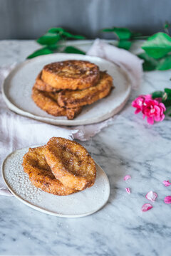 Typical homemade Spanish torrijas on marble table