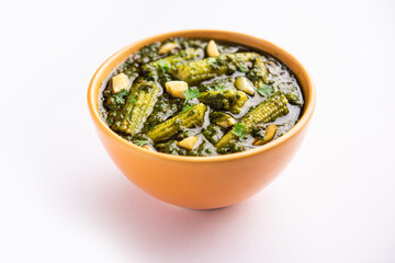 palak baby corn sabzi also known as spinach makai curry served with rice or roti, Indian food