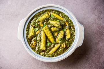 palak baby corn sabzi also known as spinach makai curry served with rice or roti, Indian food