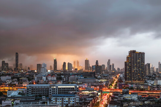 Menacing storm above Bangkok city life background © Waraphorn Aphai