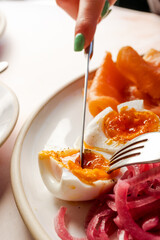 Cutting a soft-boiled egg 