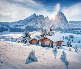 Untouched winter landscape. Frosty morning view of Alpe di Siusi village. Attractive winter landscape of Dolomite Alps. Exciting outdoor scene of ski resort, Ityaly.