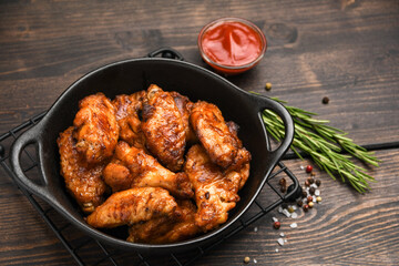 Lunch fast food chicken wings with ketchup and potatoes fries	
