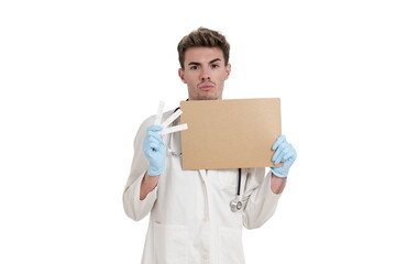 Young caucasian male doctor holding a board and negative covid-19 antigen test. Isolated over white background.