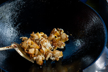 fried pork in black pan