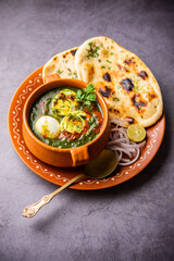 Spinach egg curry is an Indian non vegetarian dish made using palak gravy with eggs